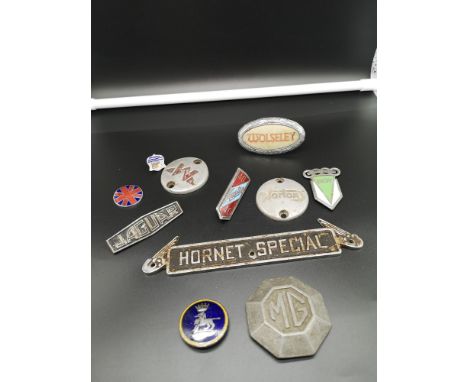Collection of vintage car badges. 
