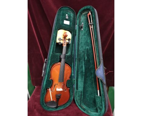 Violin with bow in fitted case. 