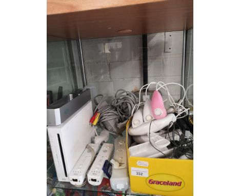 Nintendo wii console with accessories . 