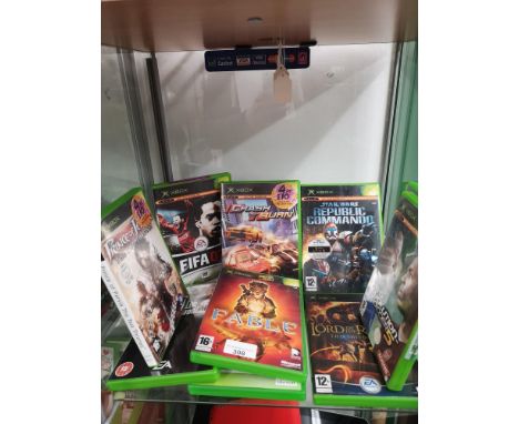 Shelf of Xbox original games. 