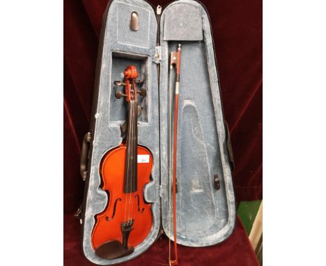 Violin with bow in fitted case with label. 