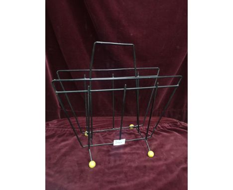 A vintage 1950s atomic ball magazine rack. 