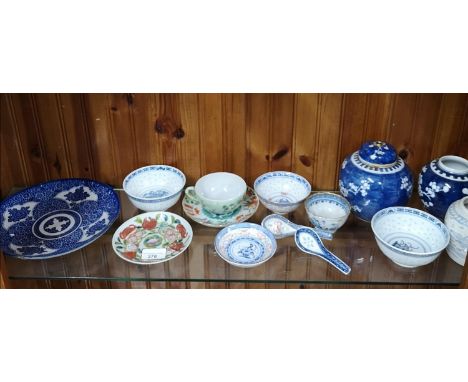 Shelf of chinese wares to include blue and white chinese plate . 