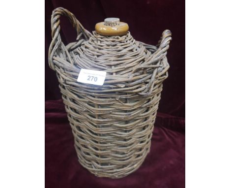 Vintage flagon support in wicker binding. 