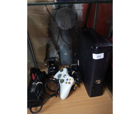 Xbox 360 slim console with controller. 