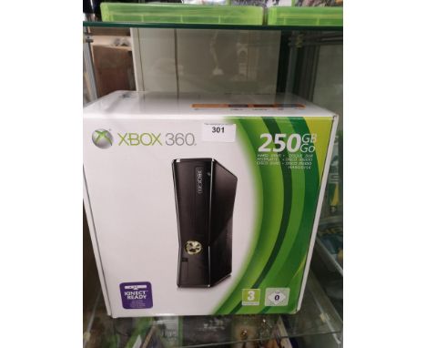 Boxed xbox 360 console . 