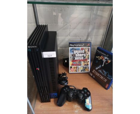 Playstation 2 console with 2 games and controller . 