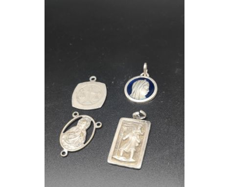 4 white metal religious pendant s one with blue enamel style setting. 