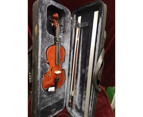 Small violin in fitted case with bow. 