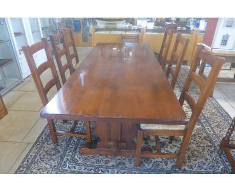 A good quality clover oak refectory table with six ladder back rush seated chairs, 76cm tall x 221cm x 90cm - in good conditi