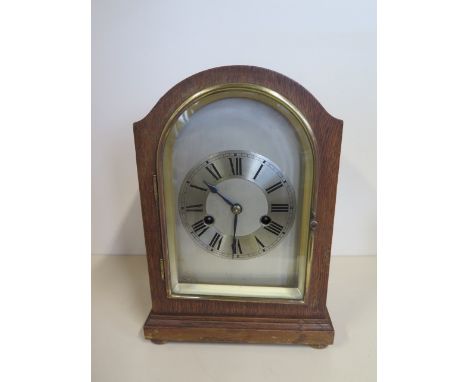 An 8 day oak case mantle clock, HAC movement, strikes hours/half - 29cm tall - working 