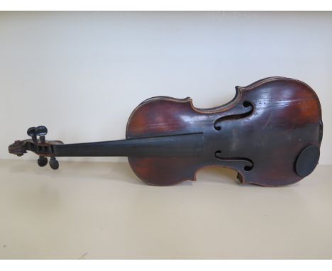 A late 17th/early 18th Century violin with a 13 7/8 back and grafted scroll bearing an old faded Antonius Stradivarius label 