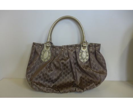 A Gucci gilt handbag, no 203626 - 467891 - 30cm x 48cm - generally good, some small usage 