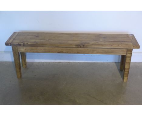 A rustic pine bench, 142cm wide 
