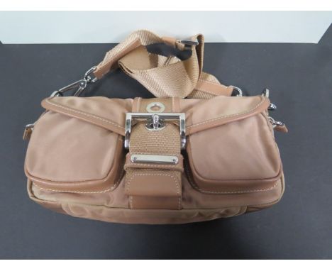 A ladies Prada handbag, with dust cover 