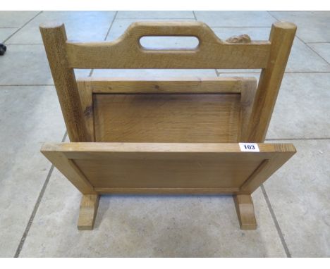 An oak magazine rack by Robert Mouseman Thompson of Kilburn with carved signature mouse - 46cm H x 43cm x 27cm - retail price