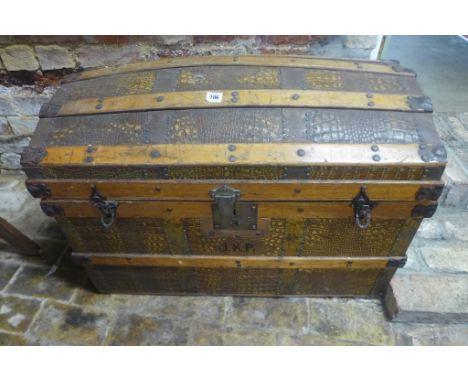 A late Victorian faux crocodile skin dome top trunk with wooden banding, 59cm tall x 84cm x 50cm - solid usable condition, mi