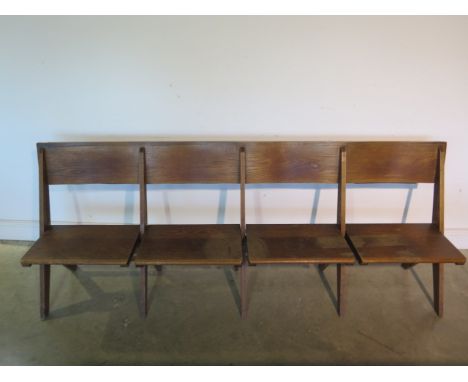 A good quality early four seater 20th century oak church bench which can fold flat, 210cm  - in sound usable condition 