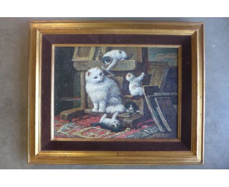 An oil painting on board of a cat and kittens playing in an artists studio, indistinctly signed presented in a gilt and velve