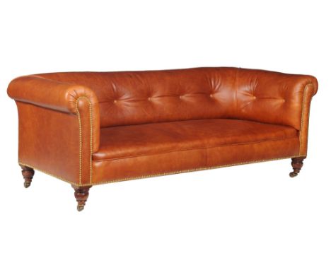  A Victorian walnut and buttoned leather upholstered sofa, by R GARNETT  &  SONS  , circa 1860, with brass studded detail, th
