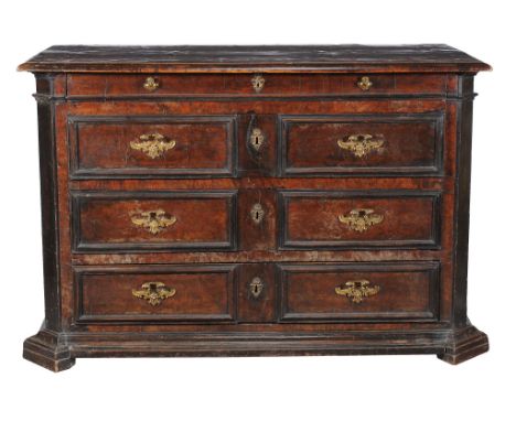  An Italian walnut commode,   second half 17th century, the moulded rectangular top above a shallow frieze drawer with handle