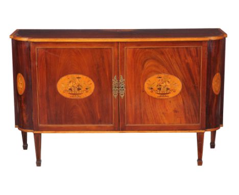  An George III Irish mahogany and marquetry commode or side cabinet,   circa 1795, of breakfront form, the shaped top above a