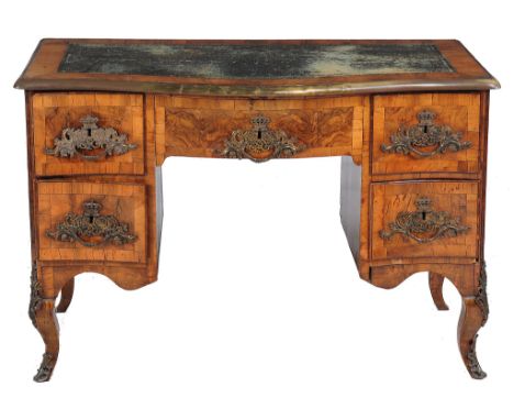  A South German walnut serpentine fronted desk  , second quarter 18 th  century , the gilt tooled leather inset top above an 