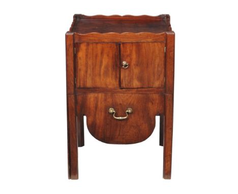  A George III mahogany night commode,   circa 1780, with a pair of cupboard doors above the sliding compartment, 76cm high, 5