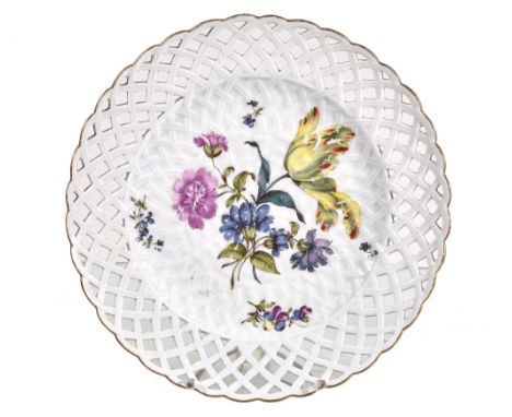  A Meissen ozier-moulded dessert plate with pierced border,   circa 1760, pai nted with   deutsche Blumen  , the pierced bord