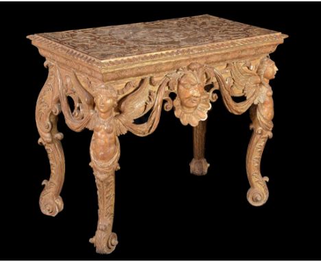  A George I giltwood and gesso console table  , circa 1720, the gadrooned oblong top incised with a symmetrical arrangement o