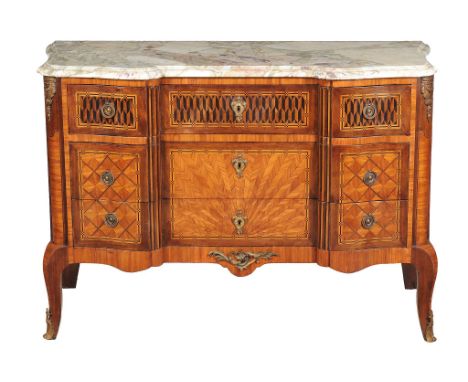 Ω A French kingwood, tulipwood and parquetry commode, in Louis XVI style, 19th century, gilt metal mounted throughout and of 