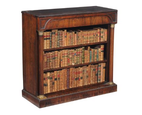 Ω A Regency rosewood open bookcase, in Empire taste , circa 1815, the rectangular top with bead moulded caddy edge, above two