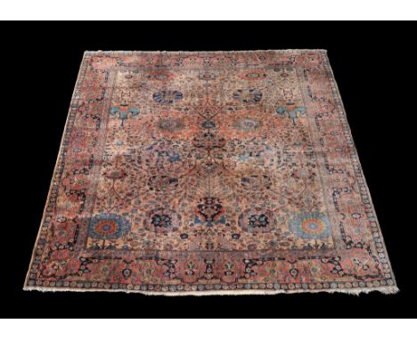  A Tabriz carpet,    finely decorated throughout with floral branches and foliage on a pale field, incorporating a flowering 