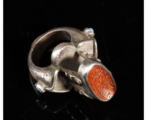 Islamic Art A carnelian seal within a silver mounted ring Persia . . Cm 4,50 x 2,50.