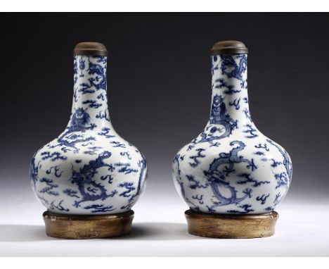 Chinese Art A pair of blue and white bottle porcelain vases previously mounted as a lamp China, Qing dynasty, Kangxi period, 