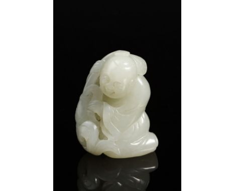 Chinese Art A white jade carving of a seated child China, 19th century . . Cm 5,00.