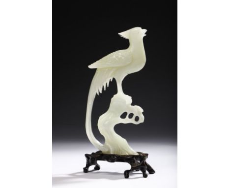 Chinese Art A jade carving depicting a bird China, 20th century . . Cm 10,00 x 24,00.