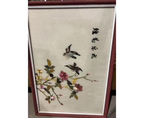 An Oriental embroidered framed silk panel of flora and fauna.   W:28cm x H:39cm