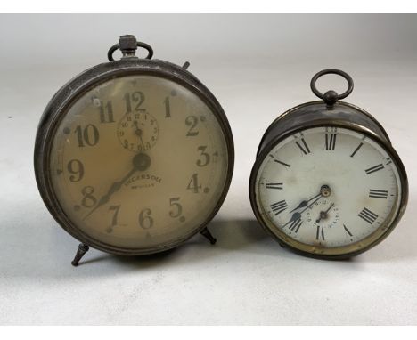 An Ingersoll Revally alarm clock and smaller brass alarm clock with bevelled glass front and key. 