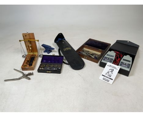 A collection of technical instruments, boxed scales and electrical watch testing tools. 