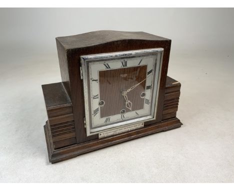 A Smiths Enfield Oak mantle clock with presentation plaque from Naval Ordnance Inspection Dept Sept 1950. W:31cm x D:13cm x H