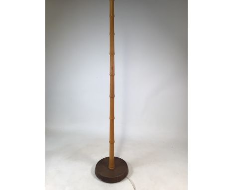 A simulated bamboo standard lamp in the style of Heals and Son. W:30cm x D:30cm x H:148cm