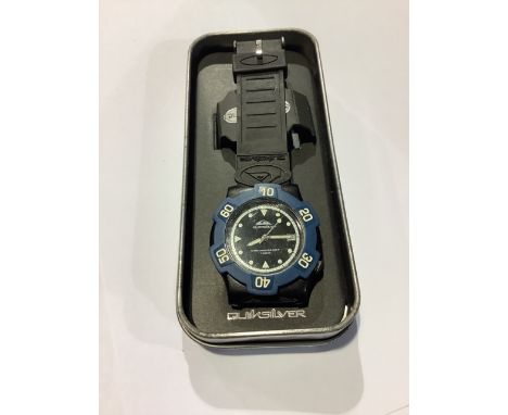 A vintage Quiksilver Chronsport 100m divers at home in original tin box. 