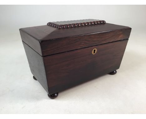 A Victorian rosewood tea caddy with oak feet and original interior.   W:28cm x D:15cm x H:16cm