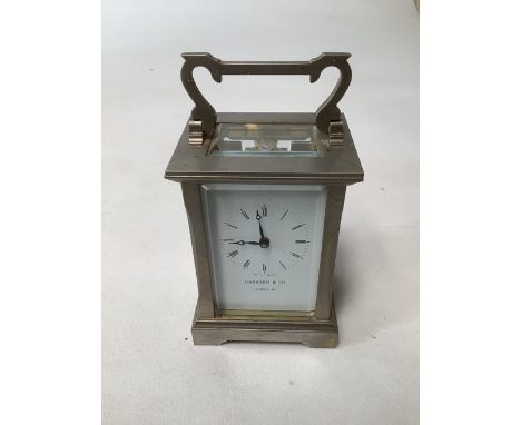 A Garrard &amp; Co gilt  brass mantle clock. 12cm(h) currently running with key.