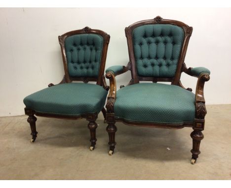 A pair of Victorian ladies and gentleman's bedroom chairs with carved details, button back upholstery, ceramic and brass cast