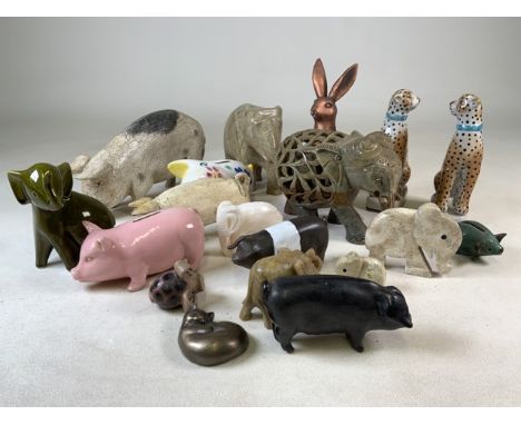 A collection of ceramic, soapstone and pottery animal figurines