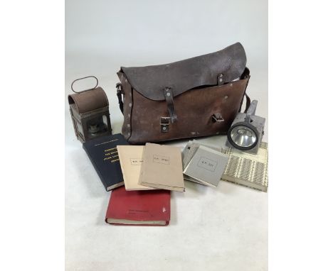 A British Rail Engine Driver of Signalmans leather bag/satchel containing signal light, lantern, BR notebooks, Diesel enginee