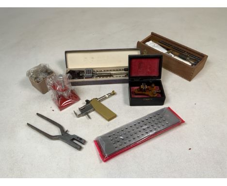A collection of watchmakers tools. 