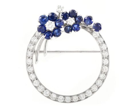 Vintage Approx. 1.50 Carat Round Brilliant Cut Diamond, Sapphire and 18 Karat White Gold Circle Pin. Diamonds G-H color, VS c